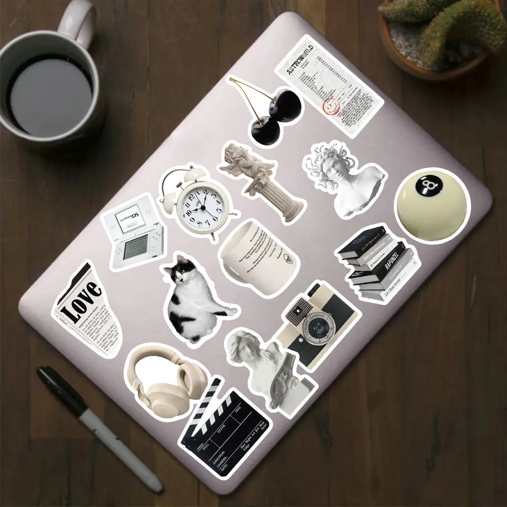 61-piece black and white waterproof PVC sticker set for laptops, phones, and cups.