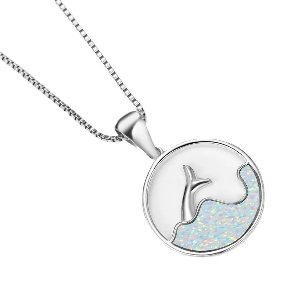 White gold electroplated copper necklace with a geometric blue opal fishtail pendant.