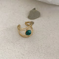 Geometric open ring with titanium steel electroplating and natural green stone elements