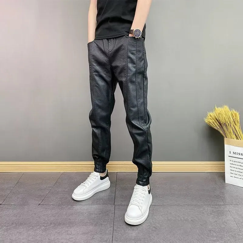 Black waterproof windproof casual rider motorcycle tapered pants with artificial leather lining and mid-rise waist