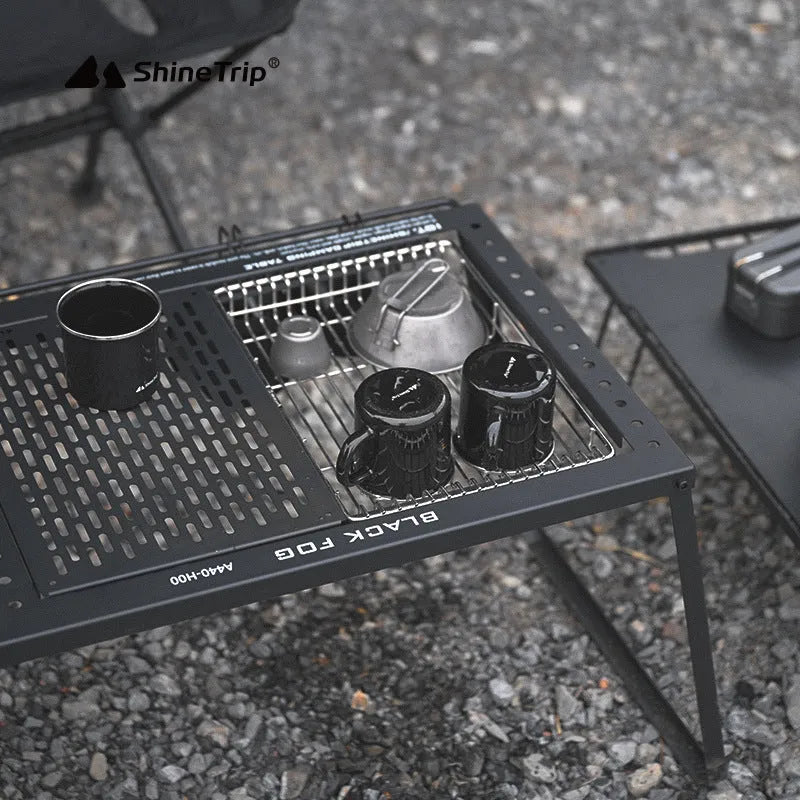 Folding carbon steel camping table with IGT modular system and multiple cell board design options.