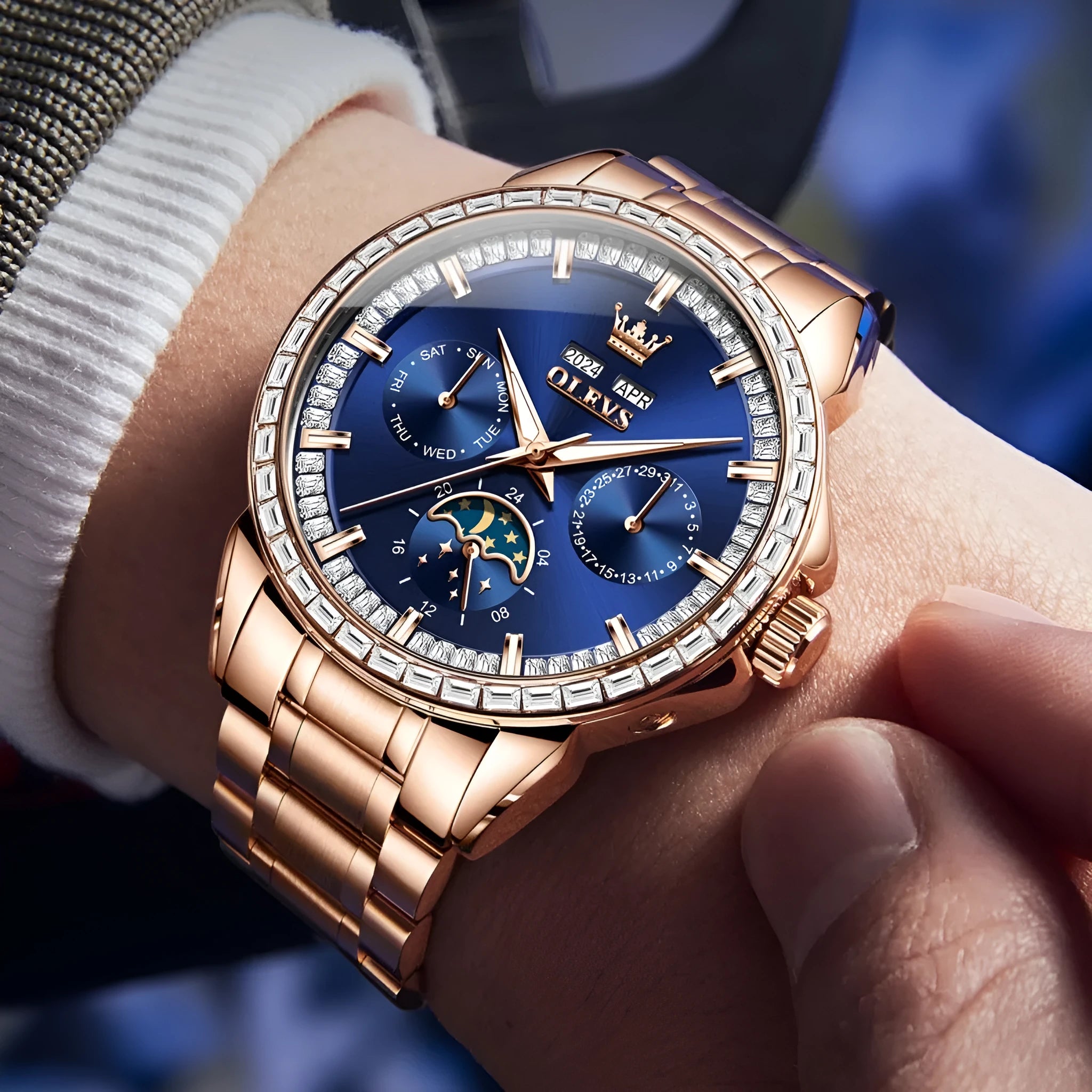 Men's stainless steel automatic watch with blue dial and exhibition caseback showing mechanical movement