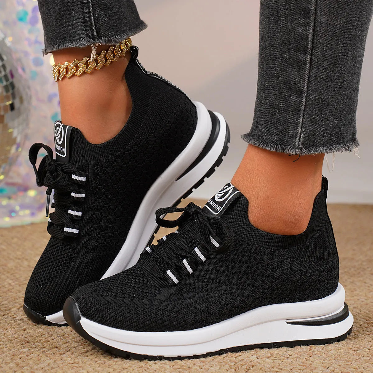 Women's black and white mesh lace-up flat pumps with a round toe and rubber sole.