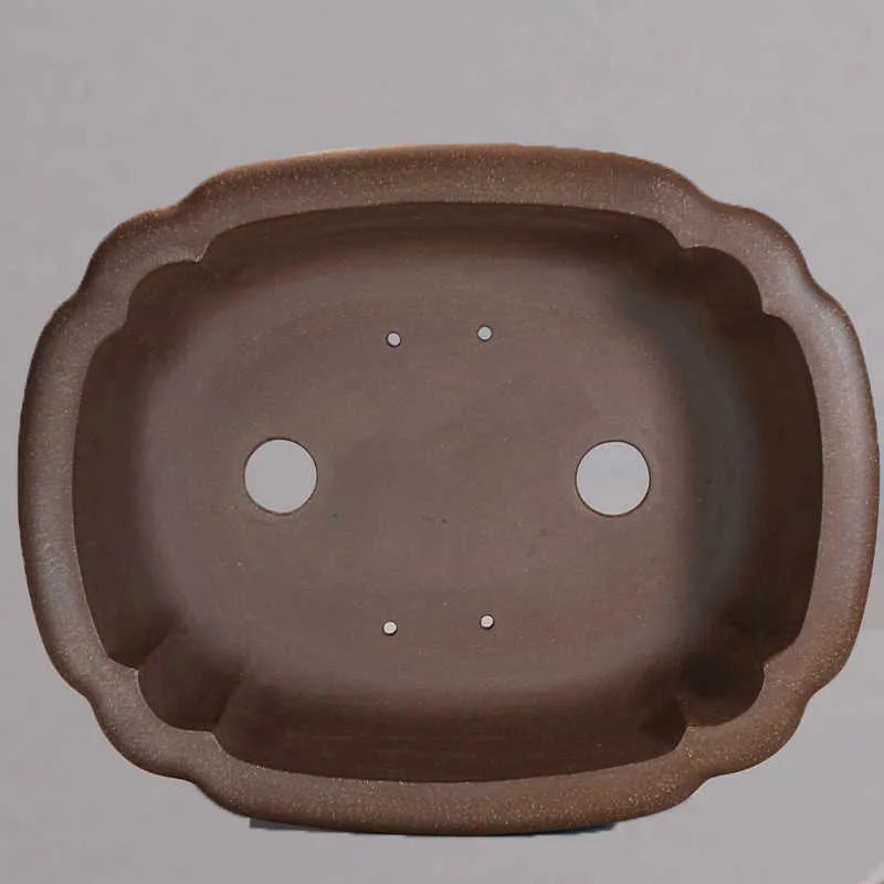 Handmade purple clay rectangular begonia flower pot for desktop plants.