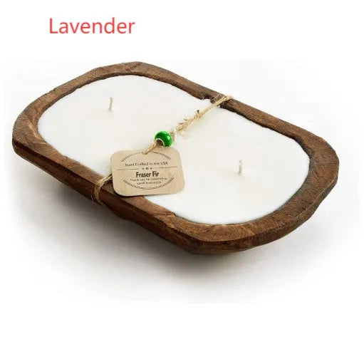 Lavender-scented soy wax candle in a wooden basin with a wooden wick