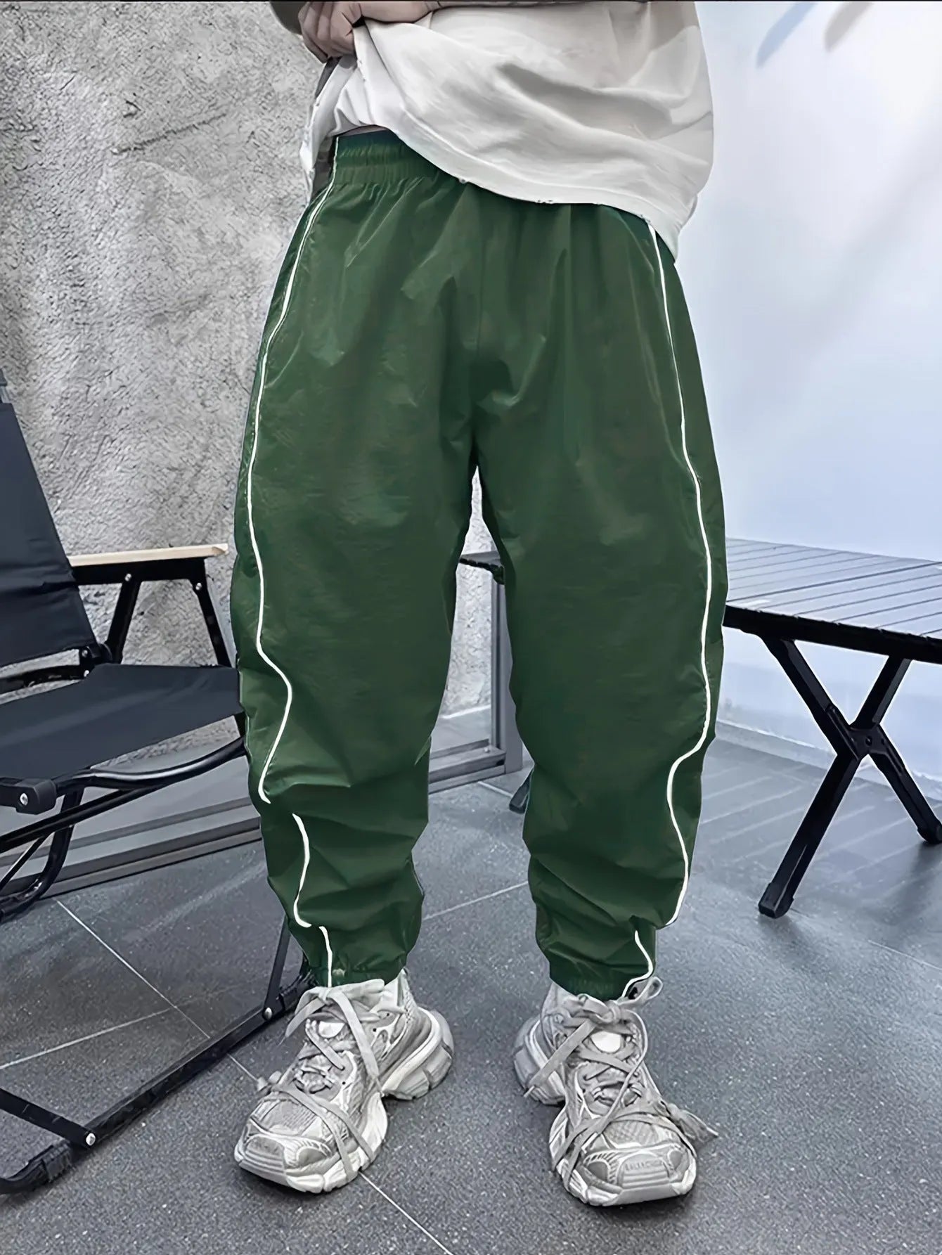 Men's loose fit bamboo fibre sports trousers in khaki with cropped length and elasticated waist.