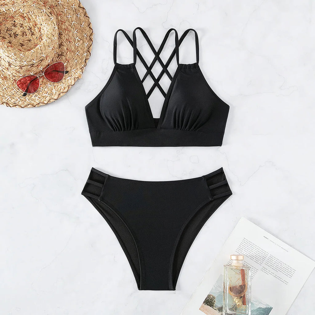 Women's black V-neck halter bikini top with matching high-leg swim shorts on a mannequin.
