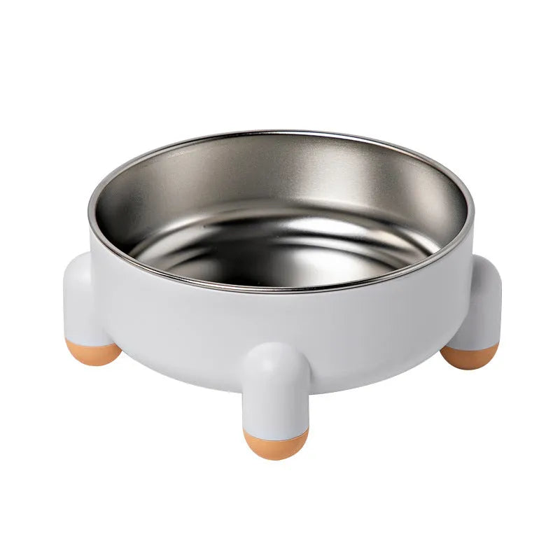 Green stainless steel pet bowl with non-slip base and raised high foot on a wooden floor.