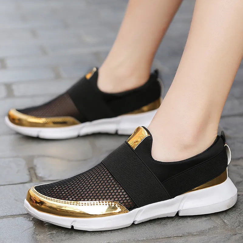 Women's blue breathable sneakers with mesh lining and low-tube design on hard floor surface