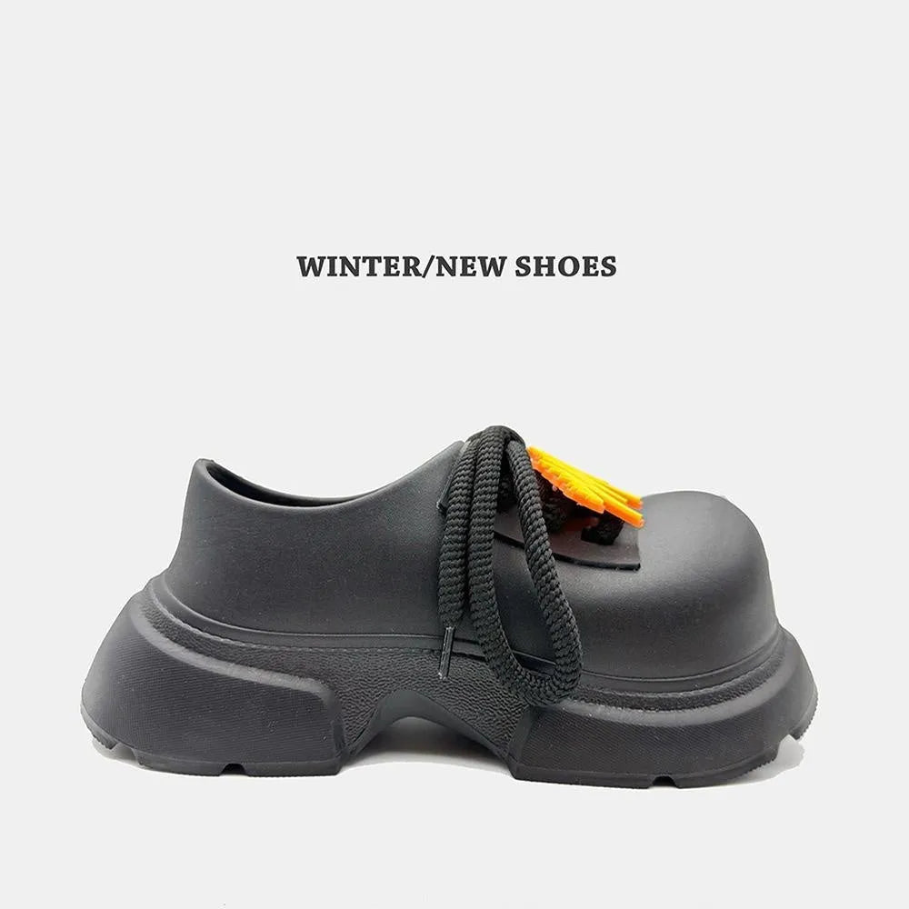 Black casual shoes with a thick EVA sole for height increase, shown from a side angle.