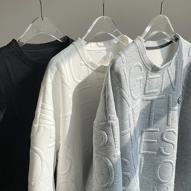 Men's grey t-shirt with a raised 3D letter print on the chest, showing a retro loose fit.