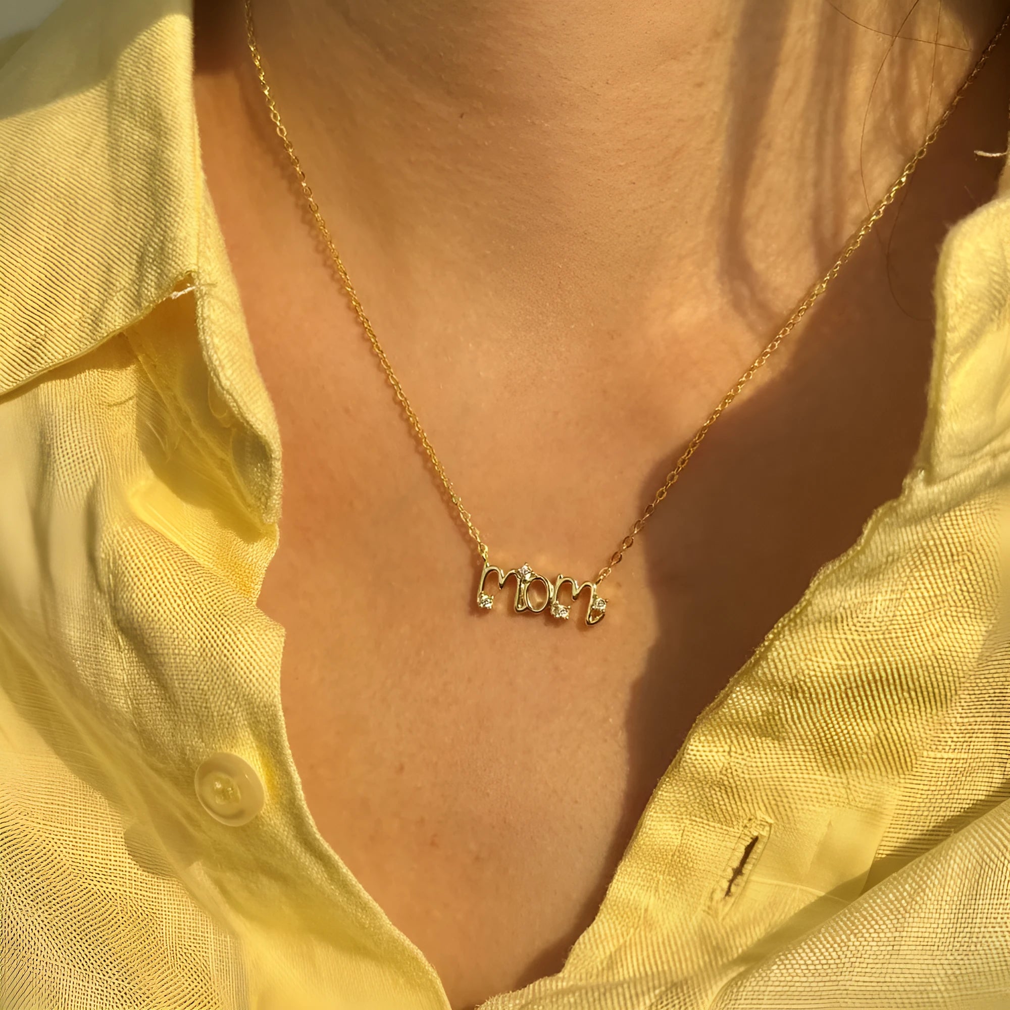 925 silver clavicle chain necklace with 15mm letter pendant in electroplated finish on display