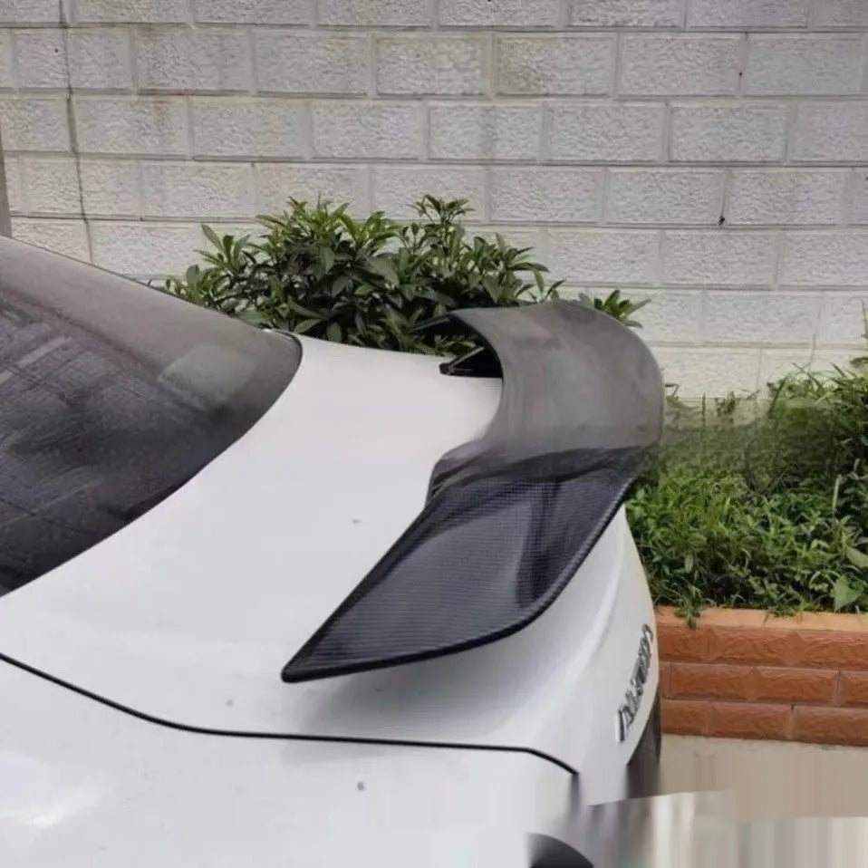 Universal punch-free fixed air design car spoiler tail wing in ABS plastic shown in various finish options.