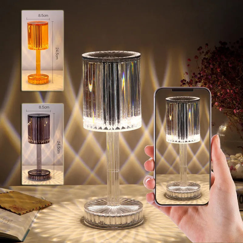 Modern crystal table lamp with transparent bead shade and metal stand on wooden surface