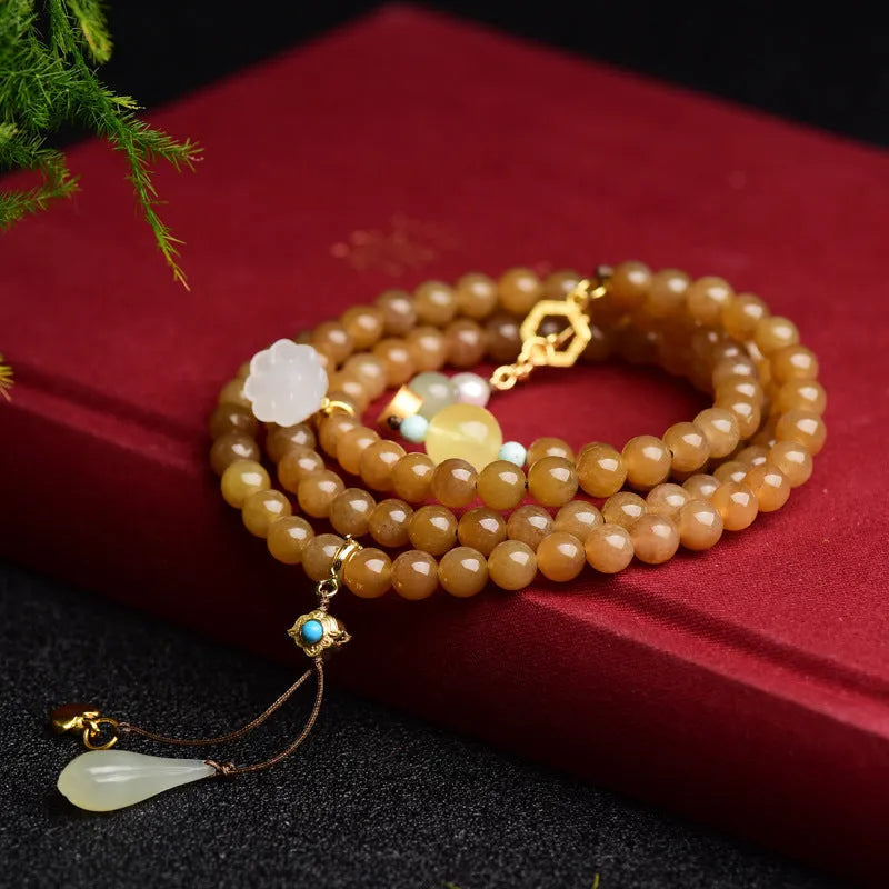 Green pine leaf jade bracelet with 6mm round beads in beeswax clear water colour