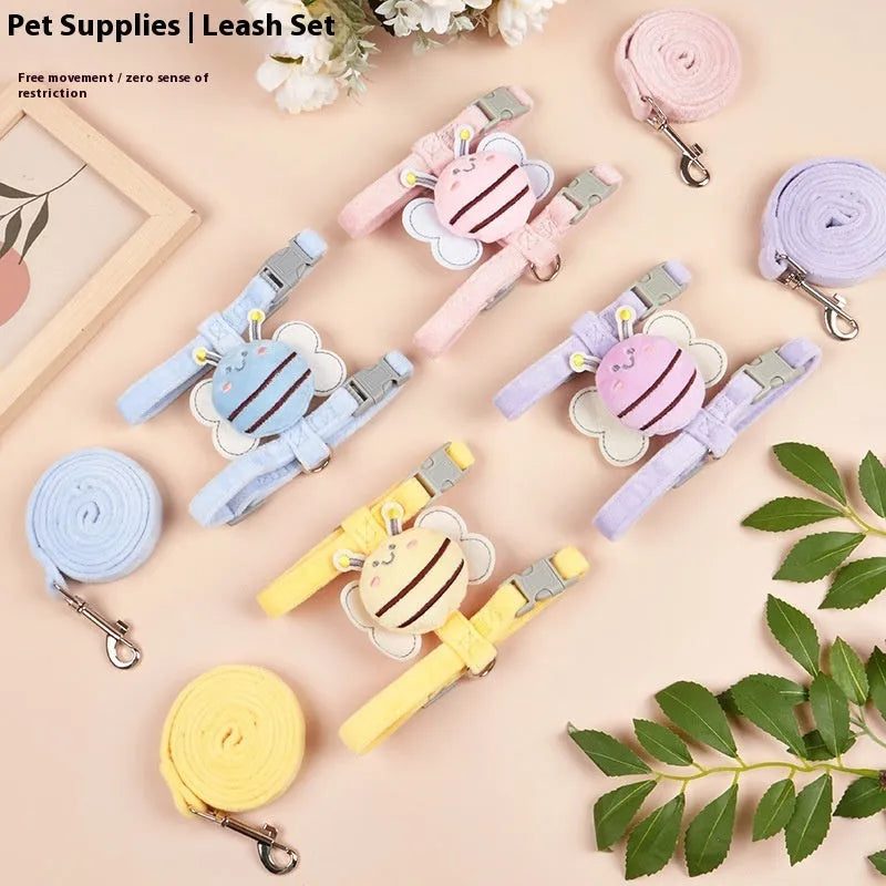 Pink teddy bee-shaped adjustable cat leash and rope on a blue background.