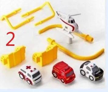 Big Adventure plastic toy set with multi-level parking garage, car tracks, and toy vehicles laid out for play.