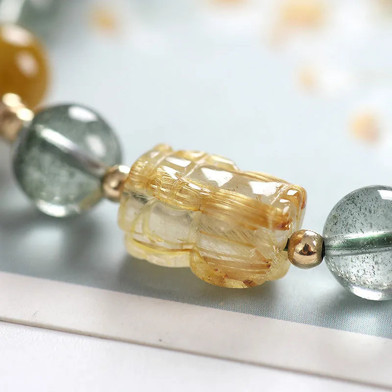Green phantom quartz crystal bracelet with rutilated inclusions, geometric ethnic design, 8mm diameter