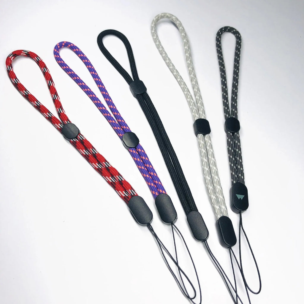 Adjustable round woven mobile phone lanyard in pink, white, and black colours