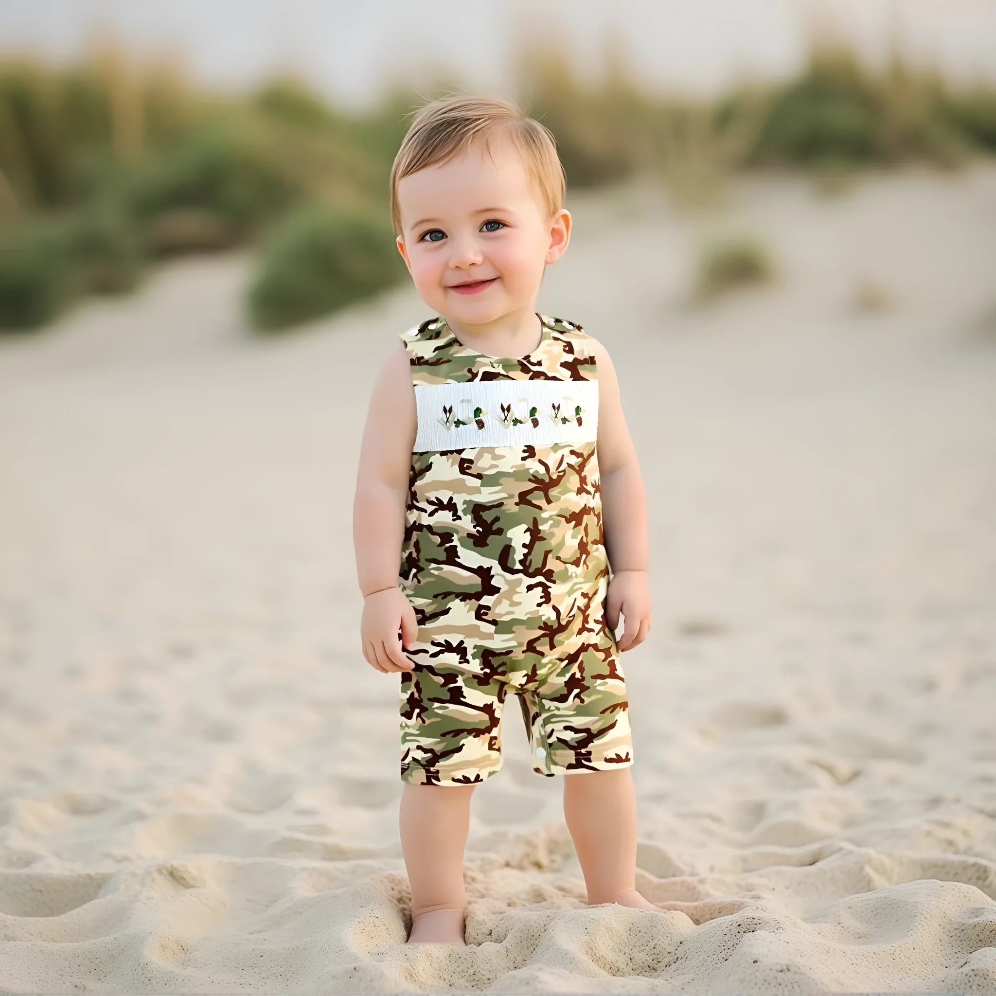 Infant toddler sleeveless duck embroidered romper in cotton knitted fabric, long sleeves, two colour options, front view.