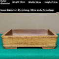 Straight-sided shallow rectangular flower pot made from unglazed Yixing purple sand clay, on a wooden surface.