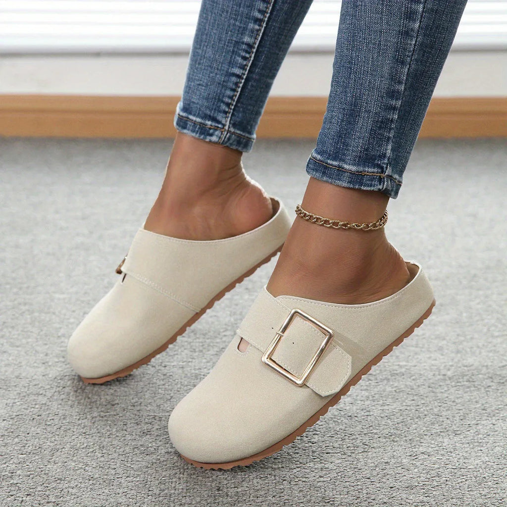 Women's brown canvas slippers with closed toe and low top design