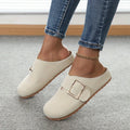 Women's brown canvas slippers with closed toe and low top design