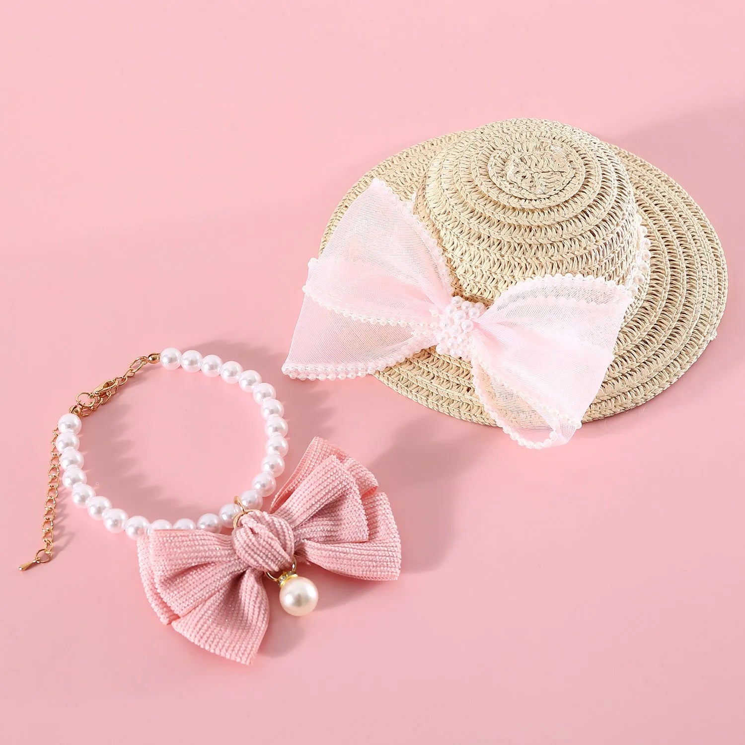 Pet cat wearing straw hat with pearl bow decoration in princess style costume accessory