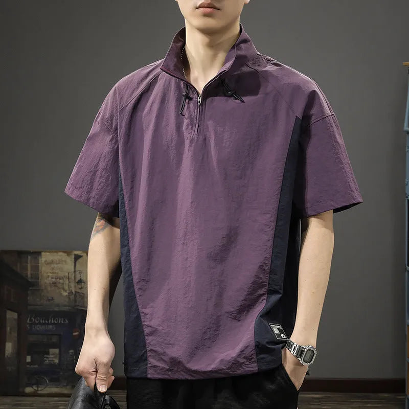 Brown men's half-zip stand collar short sleeve shirt with a fleece-lined interior on a hanger.