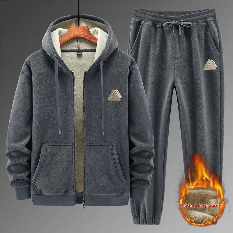 Grey cashmere-blend hooded sports jacket and matching full-length trousers laid flat.
