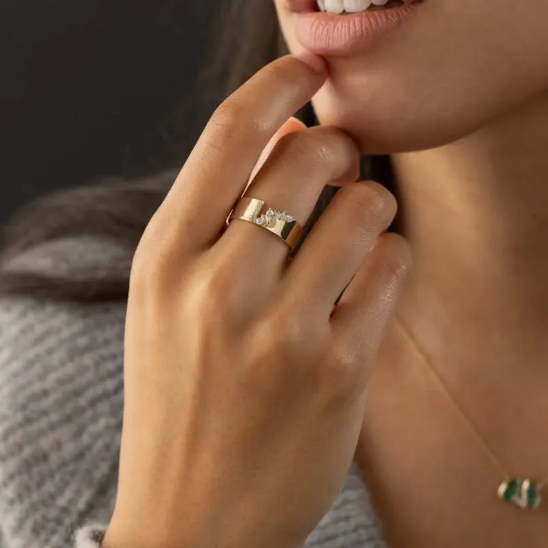 Gold electroplated copper women's ring with a cubic zirconia stone, shown in size 8.