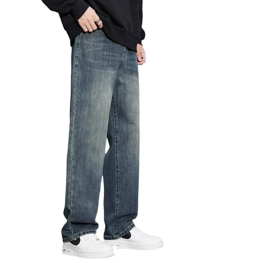 Retro straight-leg jeans for men in light blue cotton denim on a neutral background.