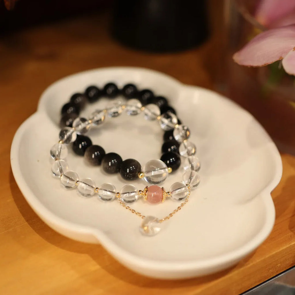 White crystal bracelet with cat eye obsidian details in Chinese geometric style