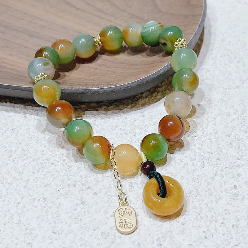 Yellow Lutong agate bracelet with peacock agate and topaz elements, peace buckle clasp, 1cm width women's jewellery
