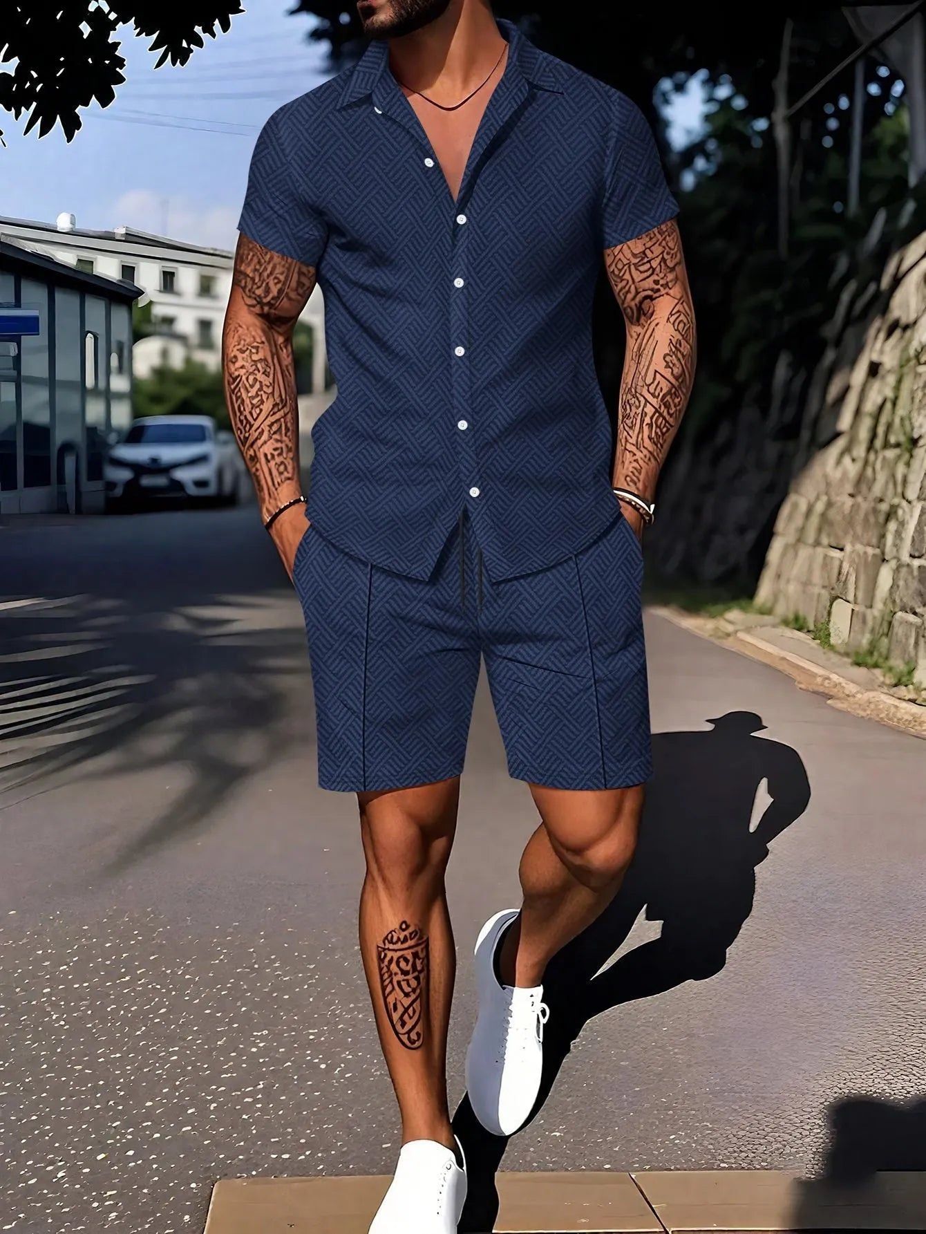 Man wearing a digital print short sleeve top and matching shorts from a casual suit set.