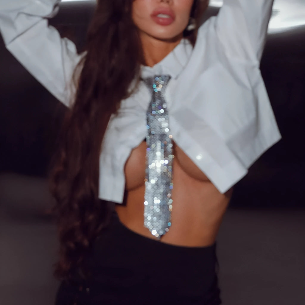 Silver metal sequin arrow-style bow tie for adult party and festival wear.