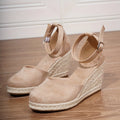 Women's apricot suede and canvas wedge sandals with a buckle strap.