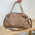 Large soft PU messenger bag in horizontal square shape with adjustable shoulder strap