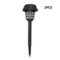 White and purple solar-powered mosquito killer lamp for outdoor garden and camping use.