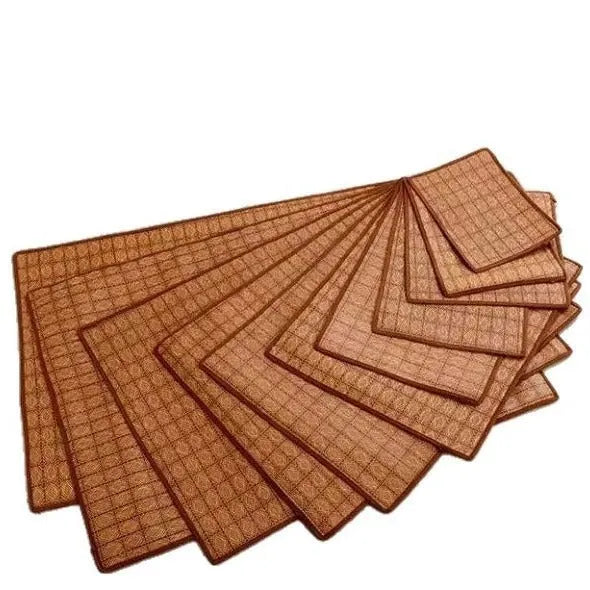 Brown rattan fibre cooling mat for dogs on a floor, showing its woven texture.