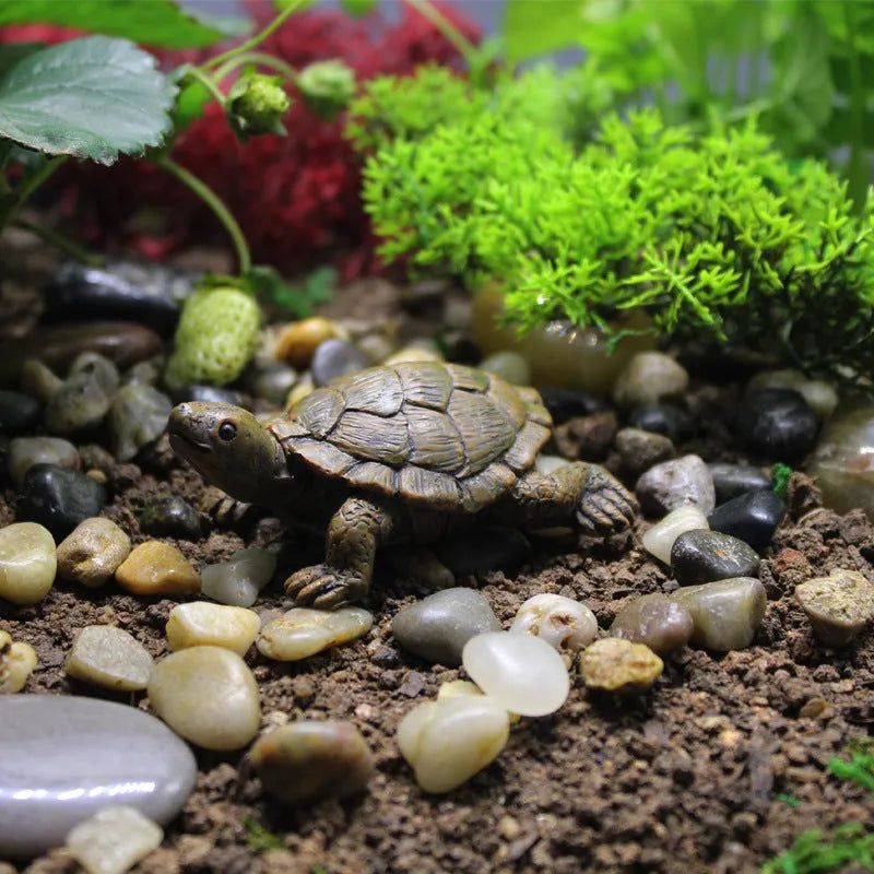 Close-up of a detailed brown resin turtle ornament for miniature garden displays.
