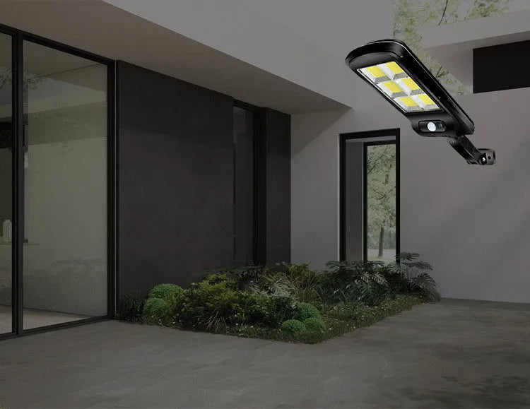 Black outdoor solar motion sensor light with solar panel and IP65 weatherproof rating