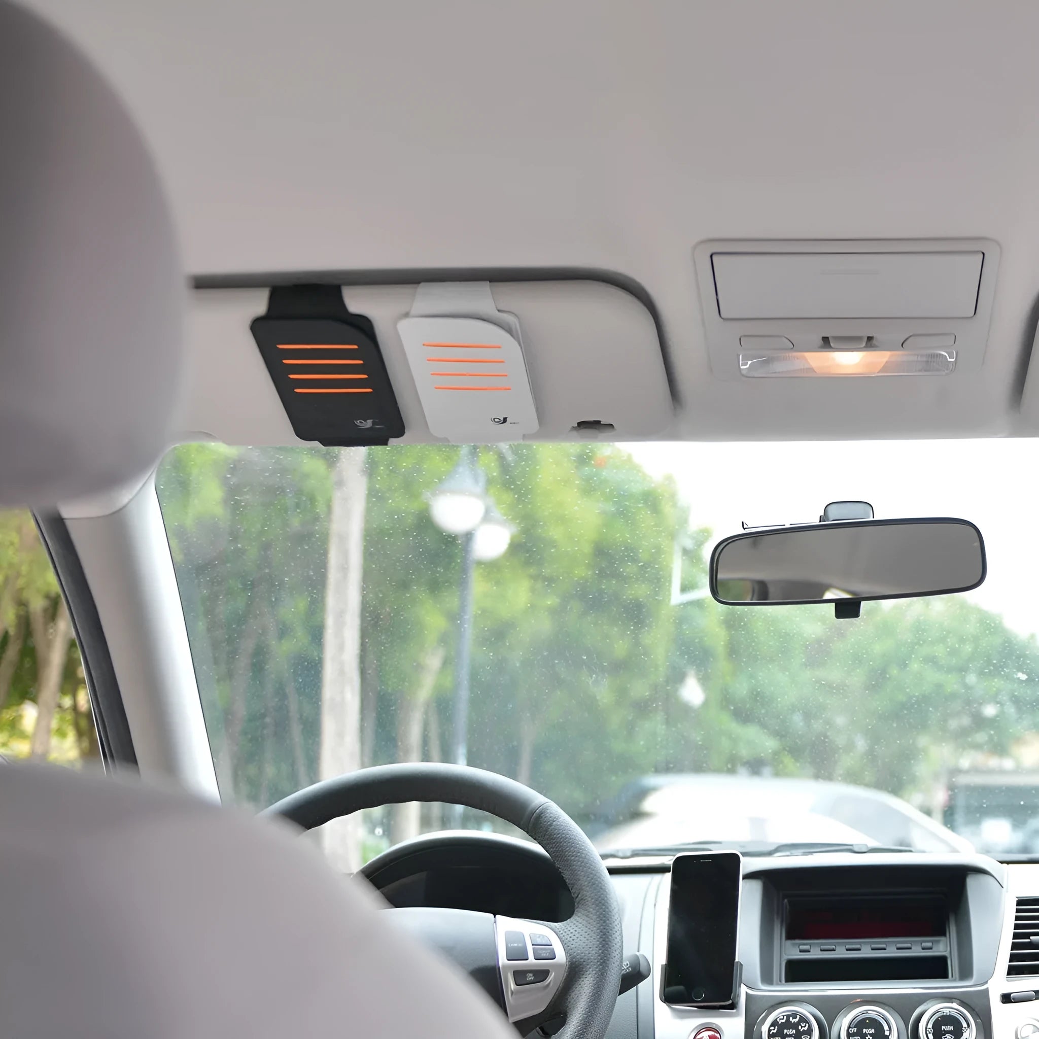 Set of four car sun visor panels and a grey vehicle-mounted card storage bag.
