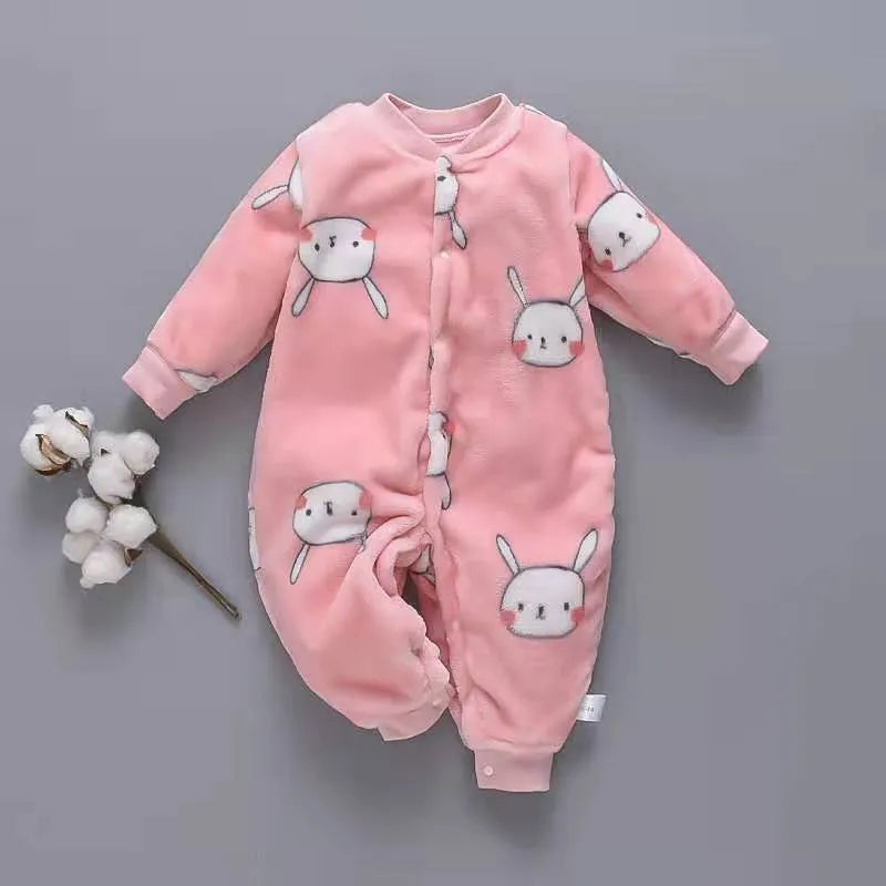 Baby wearing a long sleeve flannel romper with a printed panda pattern in pink and blue.