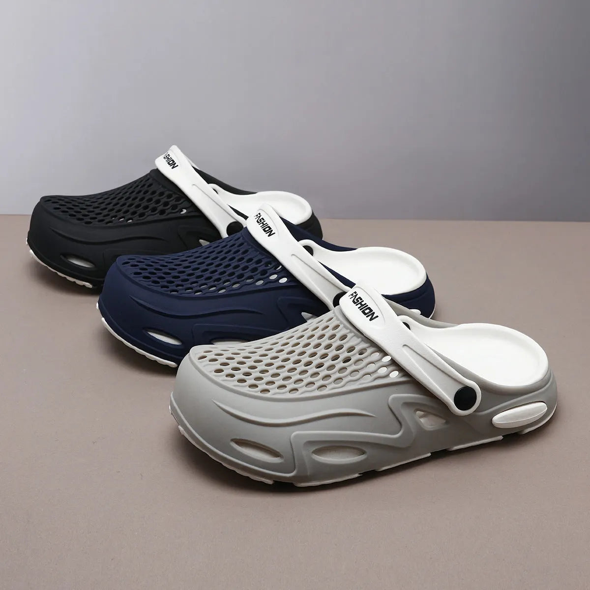 Men's closed toe beach slippers in gray colour showing grid pattern EVA construction with round toe design