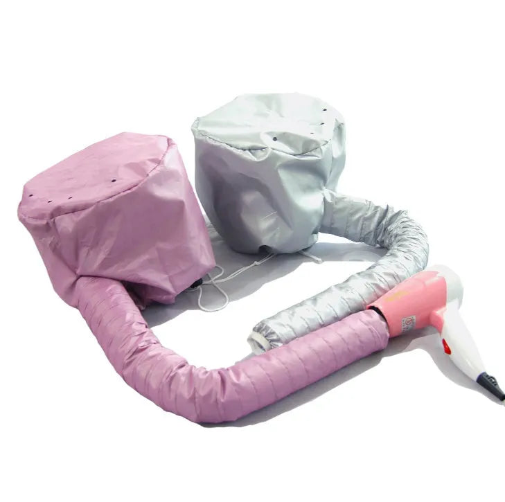 Pink hair dryer bonnet hood with drawstring on a head, attached to a hair dryer nozzle for styling