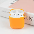 Soft silicone protective case for Bluetooth headphones in various colours on a grey background.