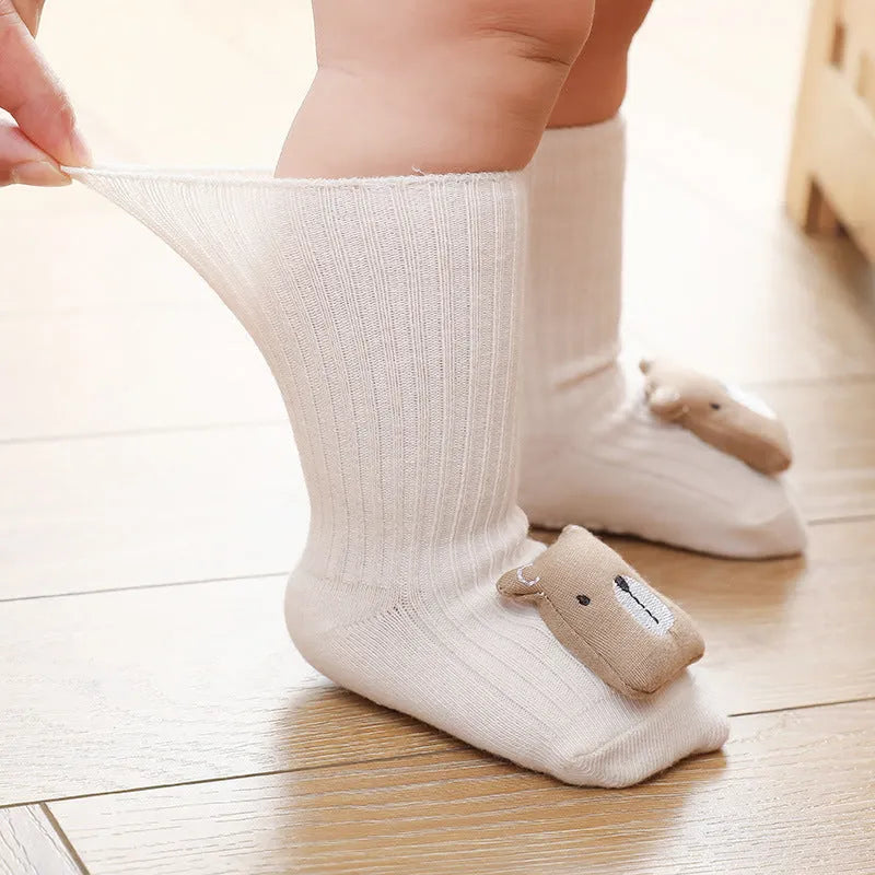 Non-slip baby socks with dispensing glue feature in cotton material, showing mid-calf height and colour options