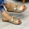Women's black fish-mouth sandals with a decorative bow on the upper.