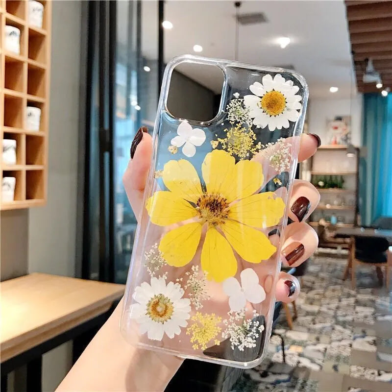 Pink and yellow floral patterned TPU back cover case for iPhone on a white background.